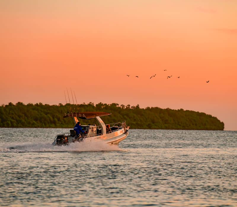 A fishing vessel operates near the exclusive Barramundi Lodge in the Northern Territory's remote Arnhem Land.
